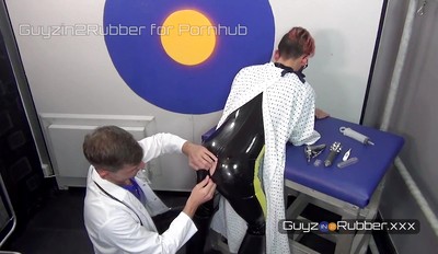 Hot Guy in Rubber asks his Doctor to stretch his arse and fuck him before he goes to a fetish party